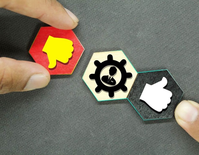 Hexagon with like and dislike icons, thumbs up and thumbs down.